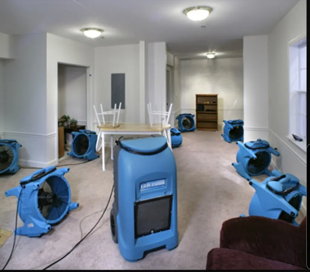 Air movers and dehumidifier setup for Water Damage Restoration in Parkland
